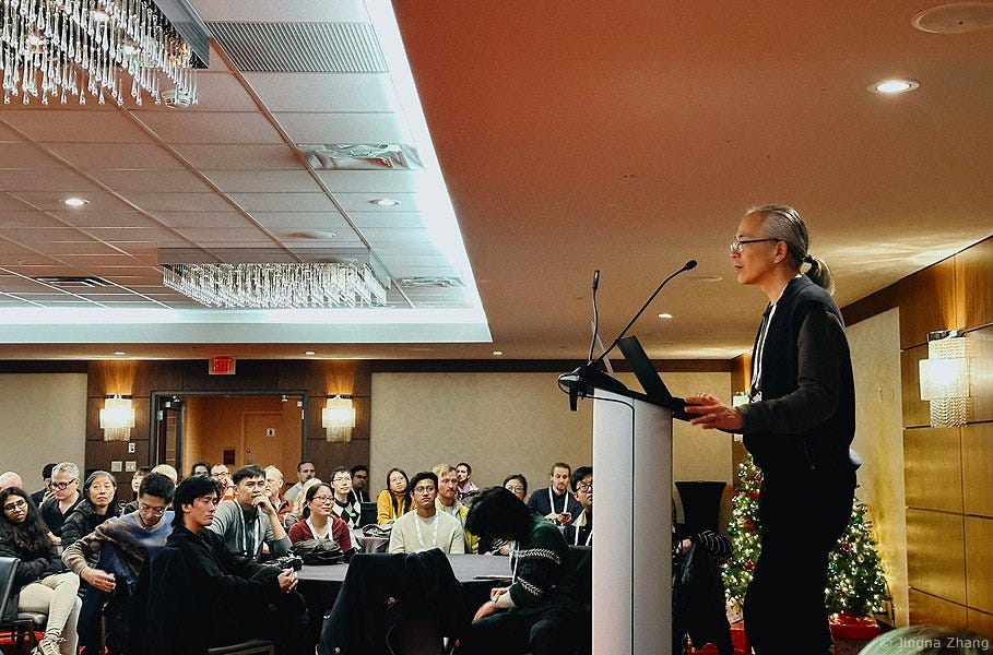 picture by Jingna
                        Zhang . Ted Chiang at Neurips 2024 addressing AI researchers - "How is what you're doing
                    different from geologists working in the oil industry? Are you using your knowledge of geology to
                    make the world a better place?"